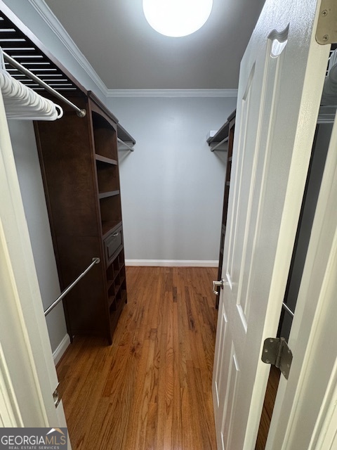 430 Bethany Road Covington, GA 30016 - Photo 22 of 39 a view of walk in closet with wooden floor