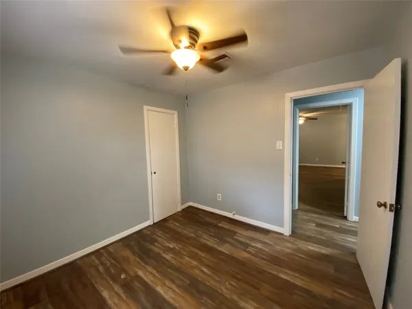 a view of room with window and ceiling fan