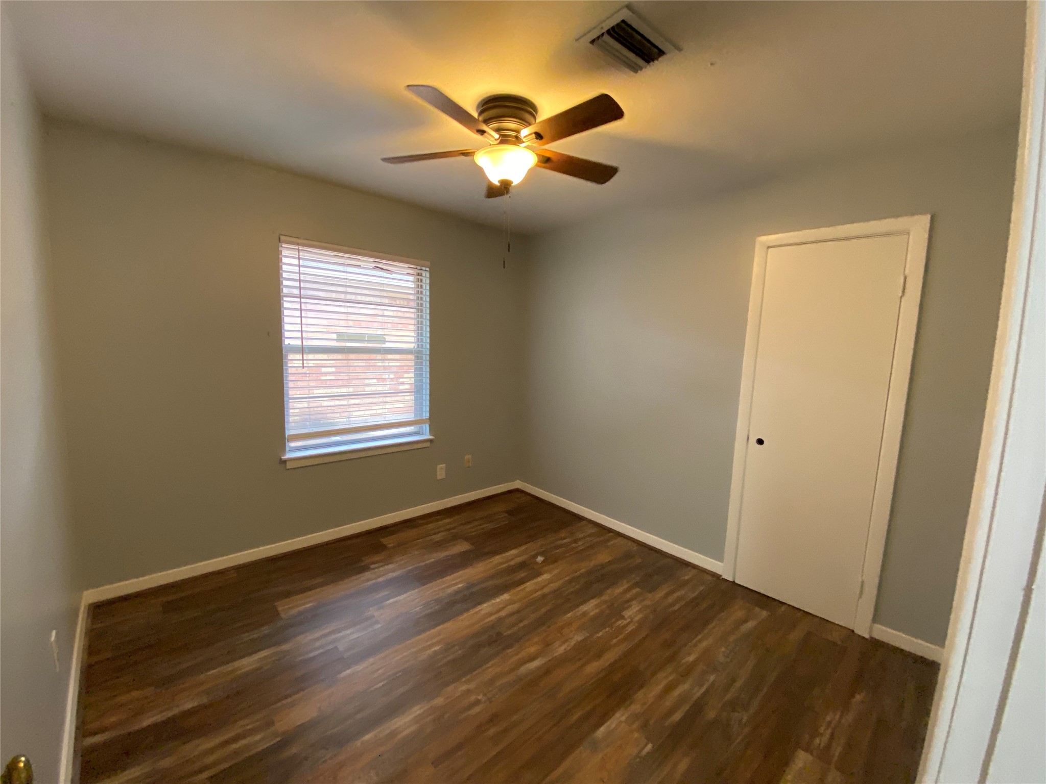 5110 West 43rd Street Houston, TX 77092 - Photo 17 of 26 a view of room with window and ceiling fan