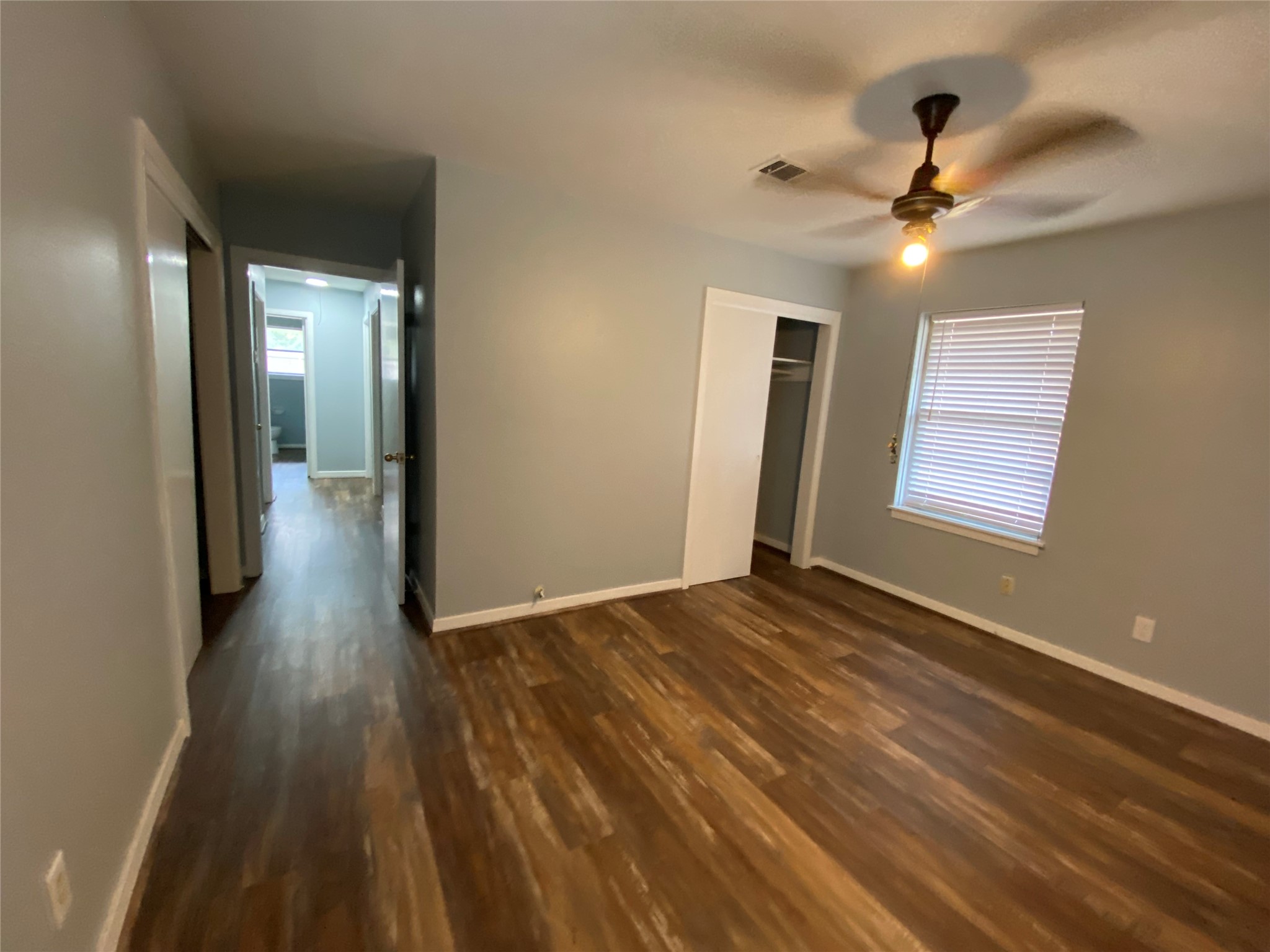 5110 West 43rd Street Houston, TX 77092 - Photo 20 of 26 a view of an empty room and wooden floor