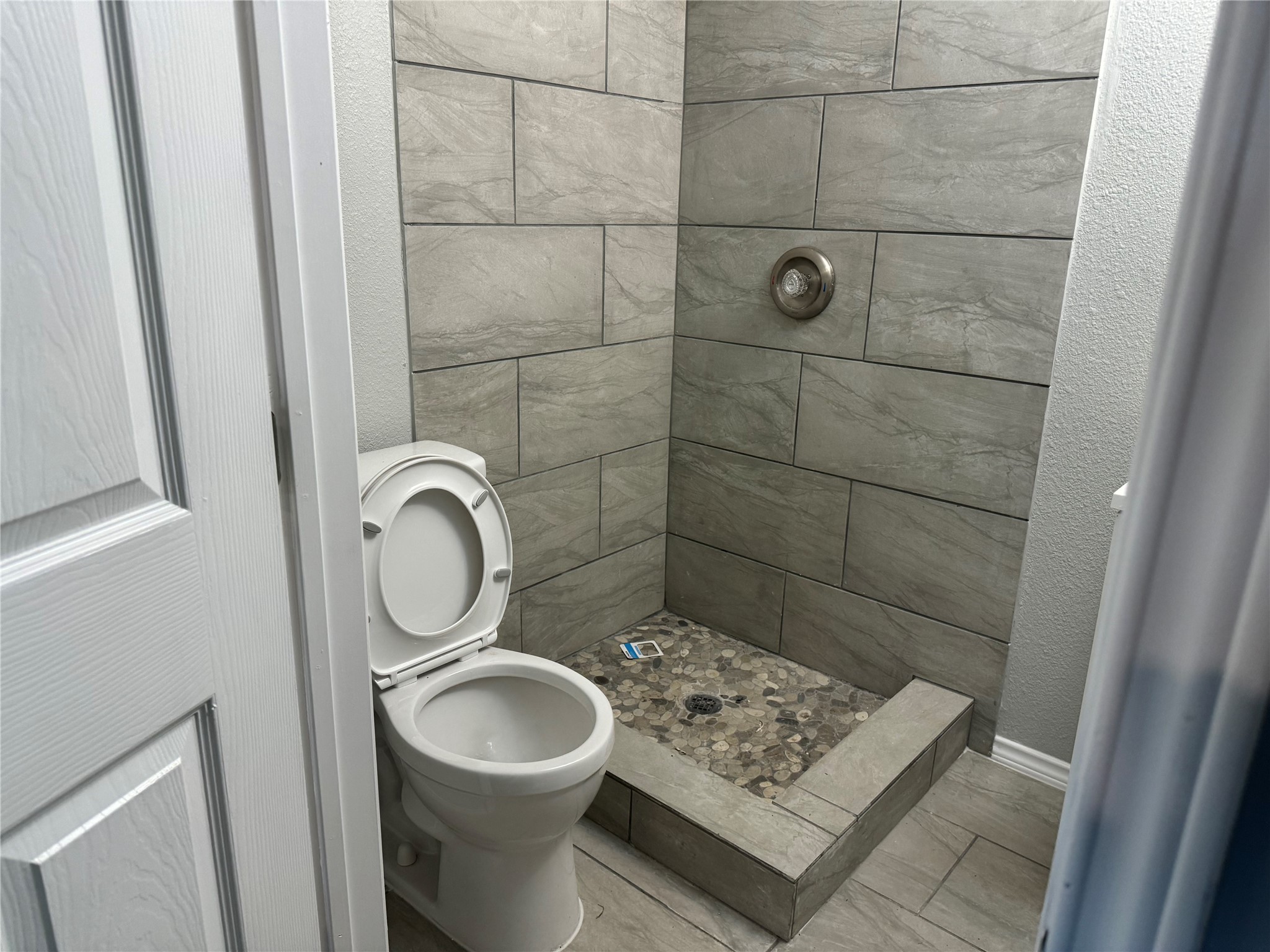 5110 West 43rd Street Houston, TX 77092 - Photo 22 of 26 a bathroom with a sink toilet and shower