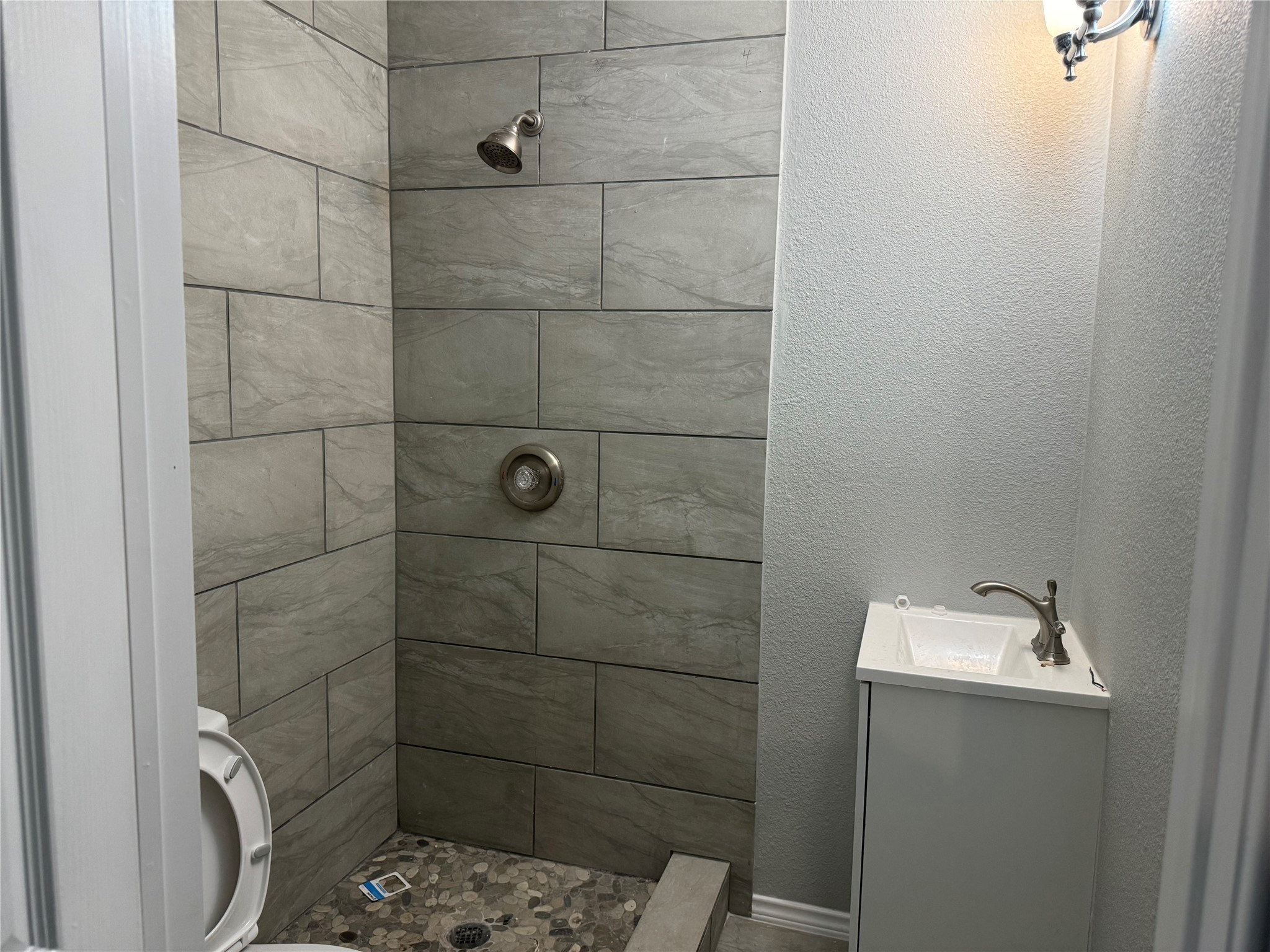 5110 West 43rd Street Houston, TX 77092 - Photo 26 of 26 a bathroom with a sink toilet and shower