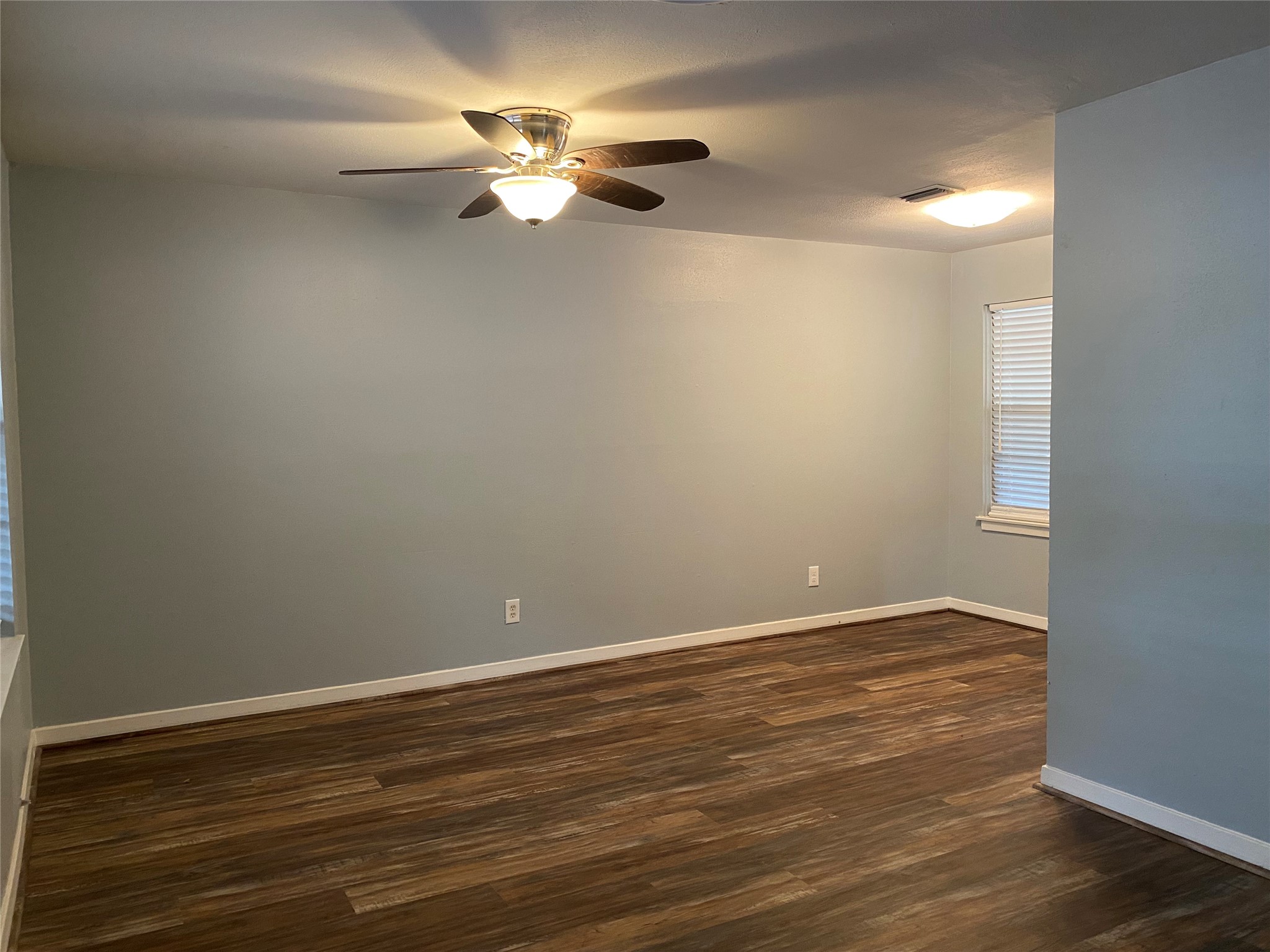 5110 West 43rd Street Houston, TX 77092 - Photo 4 of 26 a view of an empty room with wooden floor