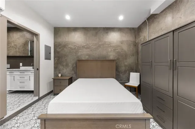 a large white bed in a white room