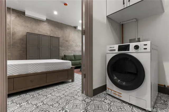 a bedroom with a bed and a view of bathroom