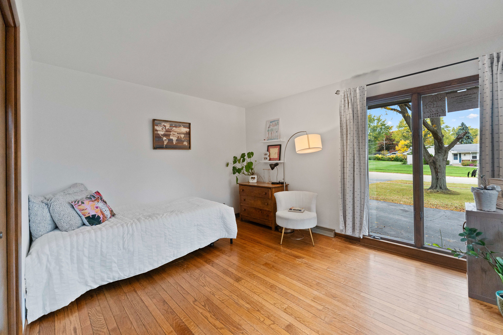 120 Stoney Creek Road DeKalb, IL 60115 - Photo 13 of 32 a bedroom with a bed and wooden floor