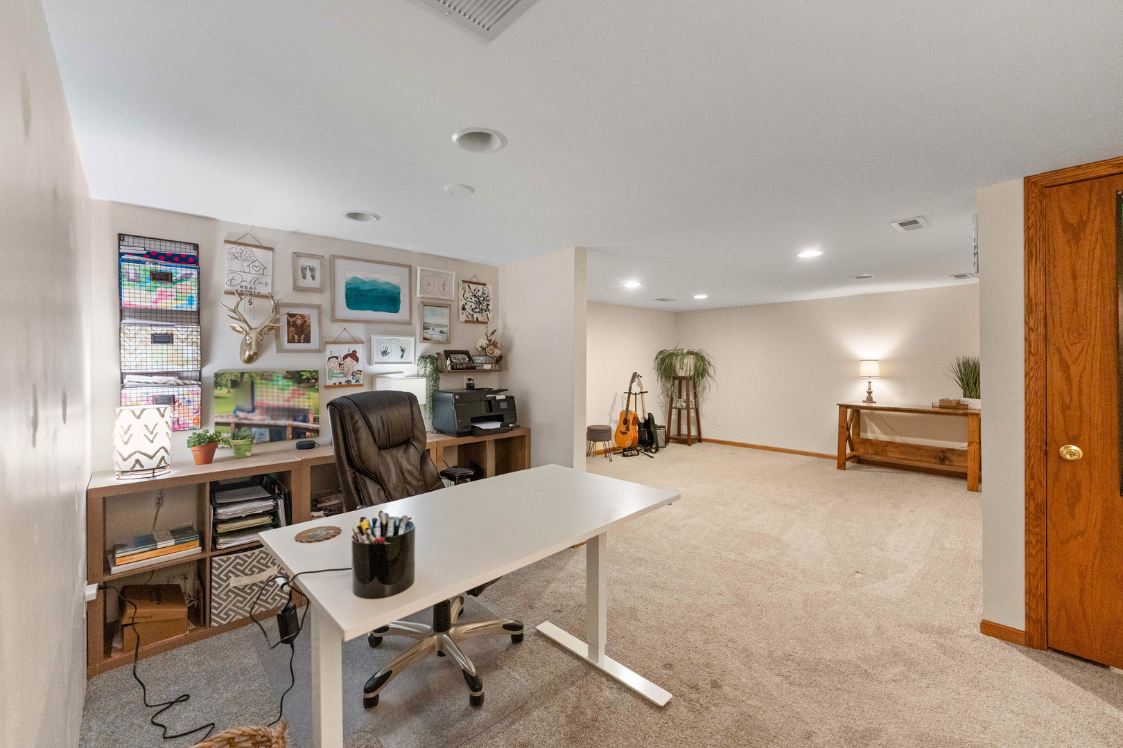 120 Stoney Creek Road DeKalb, IL 60115 - Photo 20 of 32 a view of a livingroom with furniture and a flat screen tv