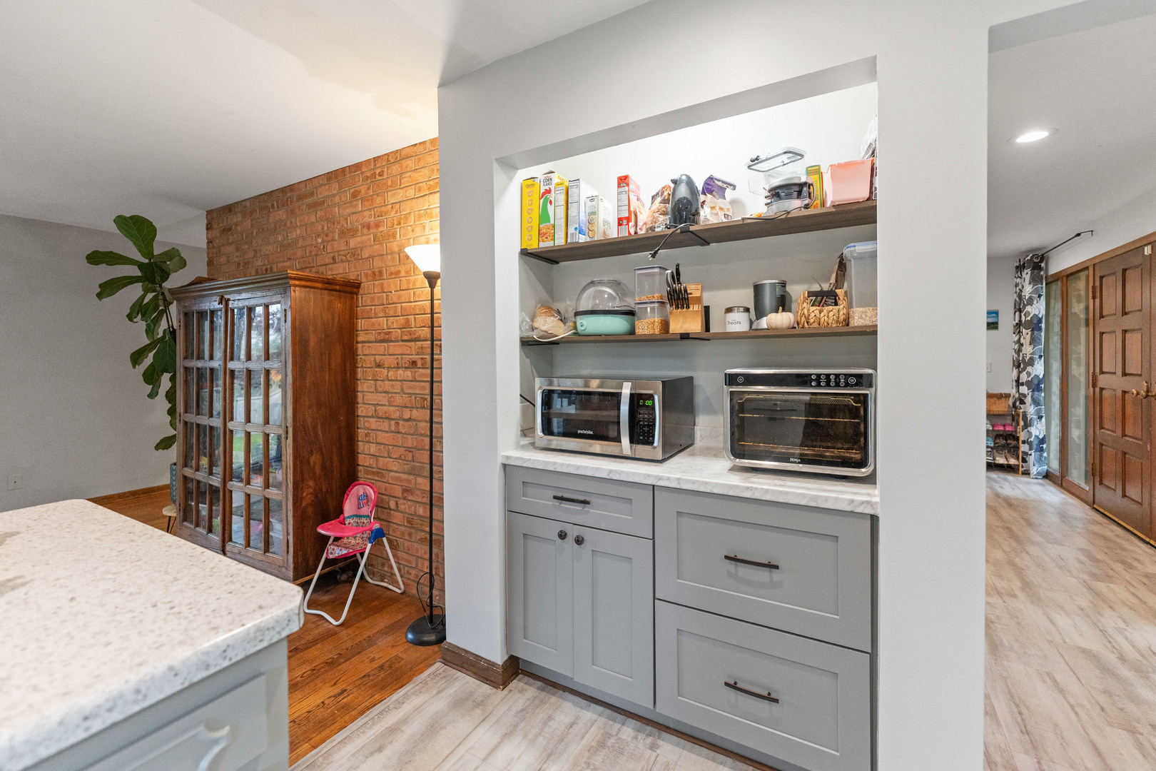 120 Stoney Creek Road DeKalb, IL 60115 - Photo 6 of 32 a kitchen with a cabinets and a wooden floor
