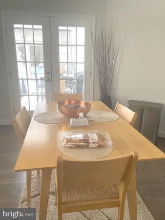 a kitchen with a white cabinets and window