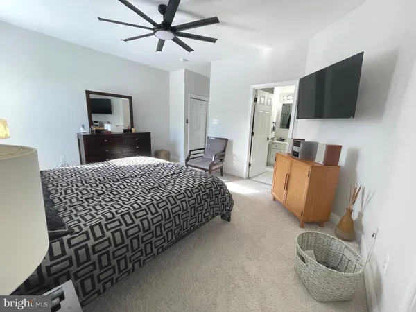 a bathroom with a double vanity sink mirror and toilet