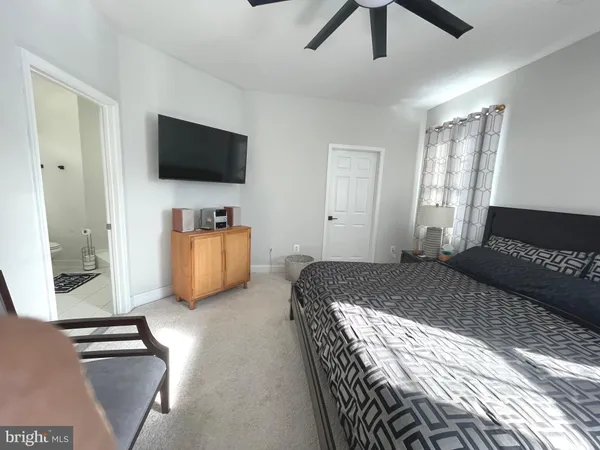 a bedroom with furniture and window