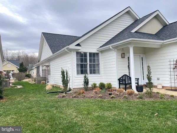 a view of a dining room with furniture and window
