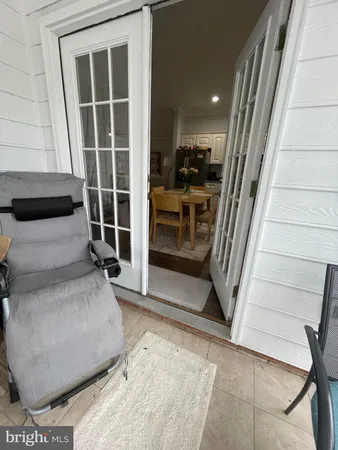 a kitchen with stainless steel appliances granite countertop a sink a stove a microwave a dining table and chairs