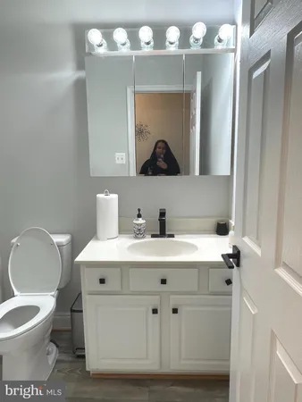 a utility room with sink dryer and washer