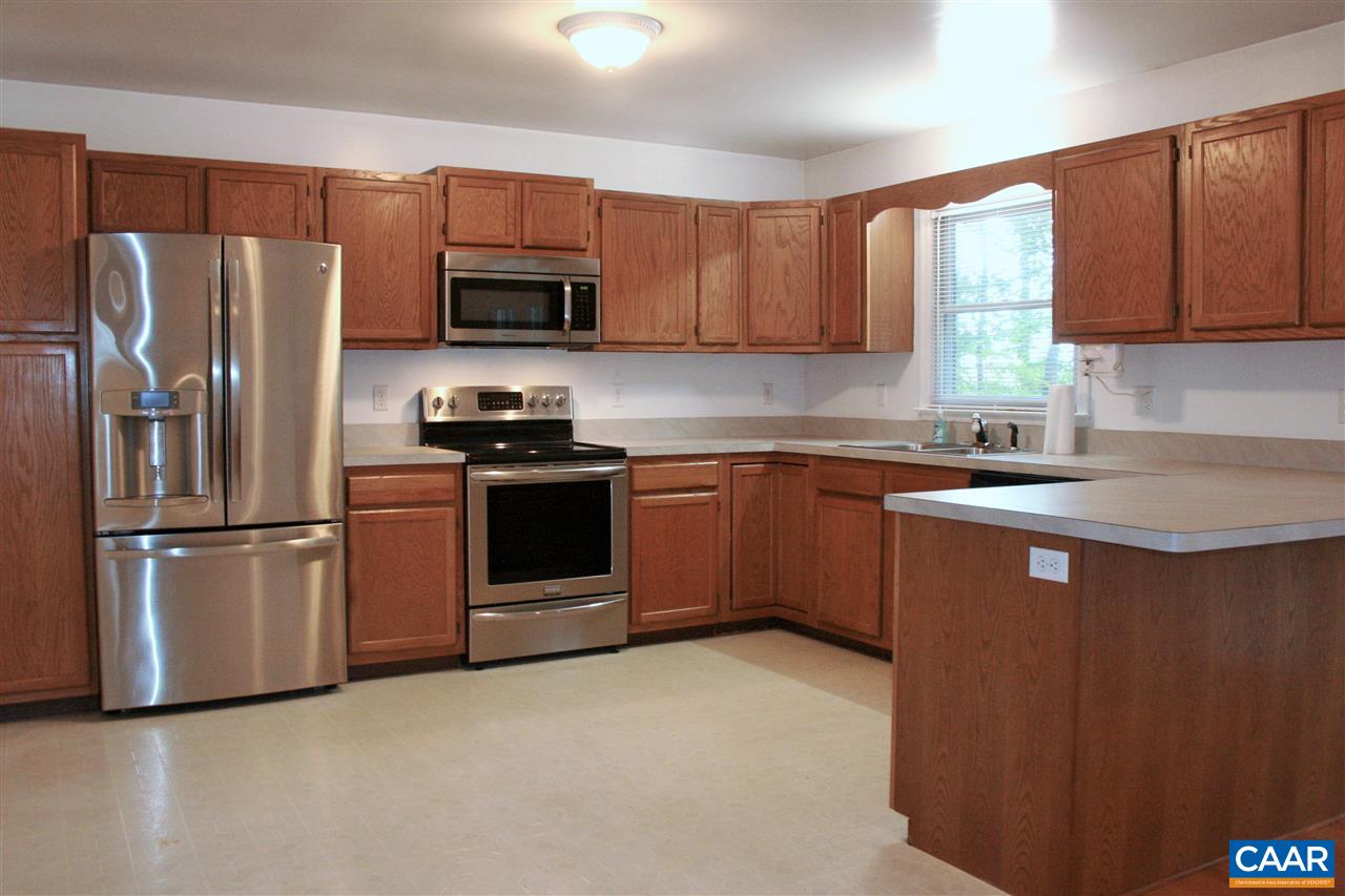 102 Thacker Road Mineral, VA 23117 - Photo 3 of 25 a kitchen with stainless steel appliances granite countertop a refrigerator stove a sink dishwasher and microwave