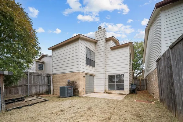 a view of a house with a yard and garage