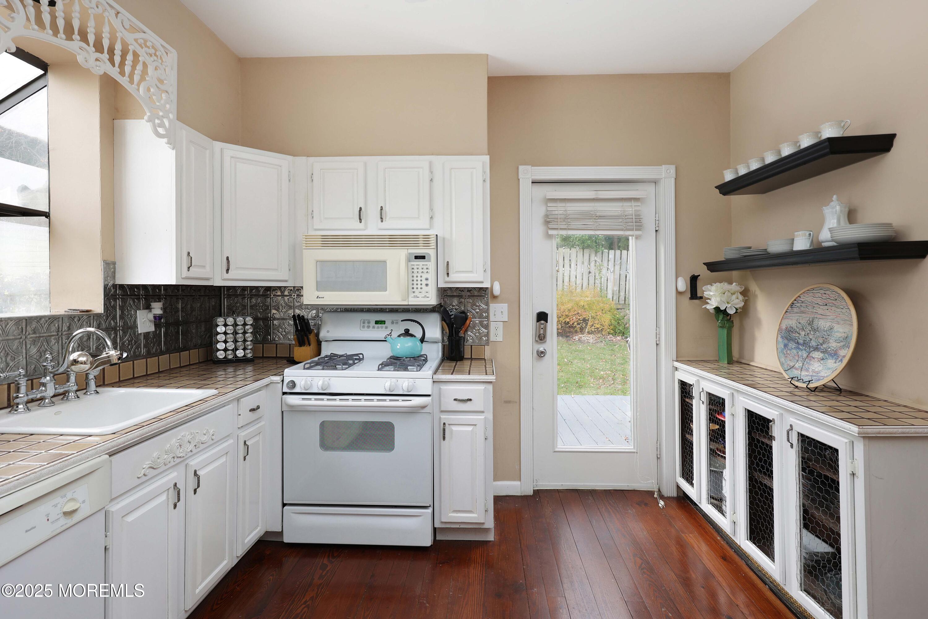 75 Portland Road Highlands, NJ 07732 - Photo 16 of 56 a kitchen with stainless steel appliances granite countertop a stove and cabinets