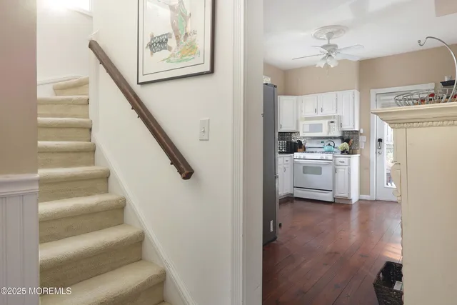 a view of kitchen with sink and wooden floor