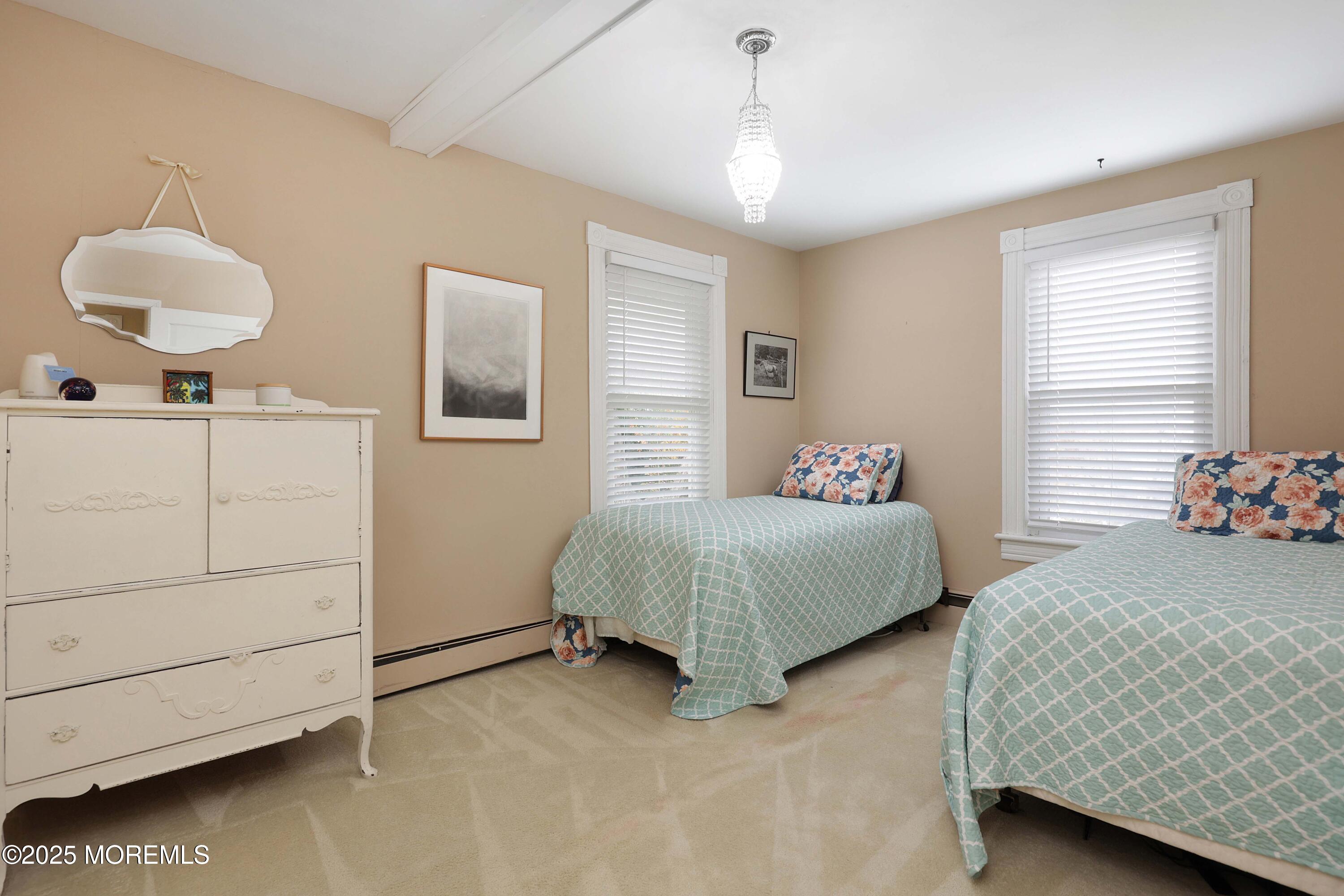 75 Portland Road Highlands, NJ 07732 - Photo 20 of 56 a bedroom with a bed and a dresser