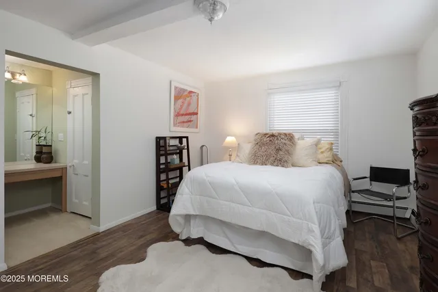 a bedroom with a bed and a television