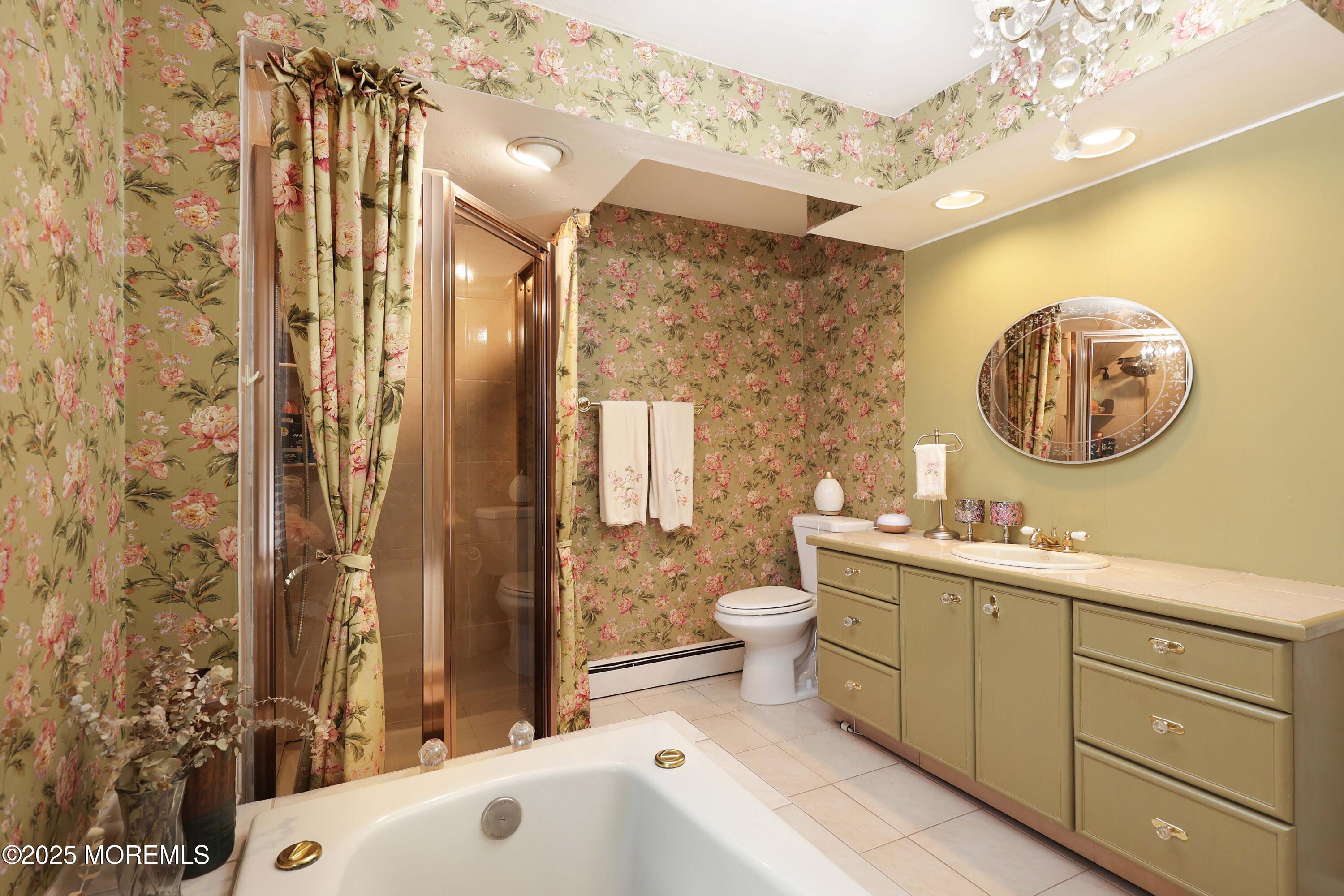 75 Portland Road Highlands, NJ 07732 - Photo 24 of 56 a bathroom with a toilet a sink and a mirror