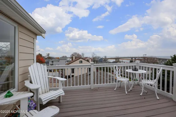 outdoor view of a house with wooden deck