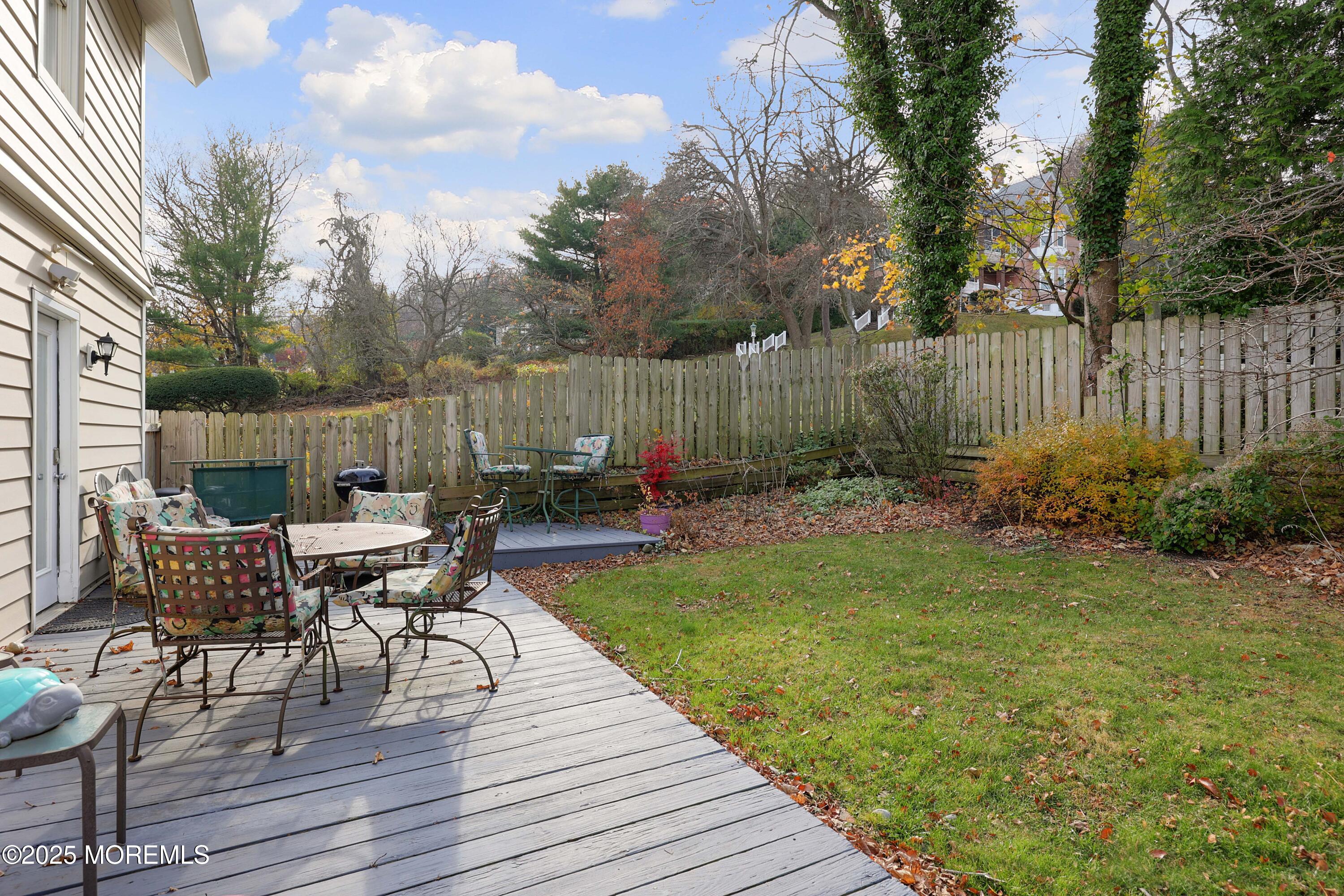 75 Portland Road Highlands, NJ 07732 - Photo 35 of 56 a view of a dinning table and chairs on the deck