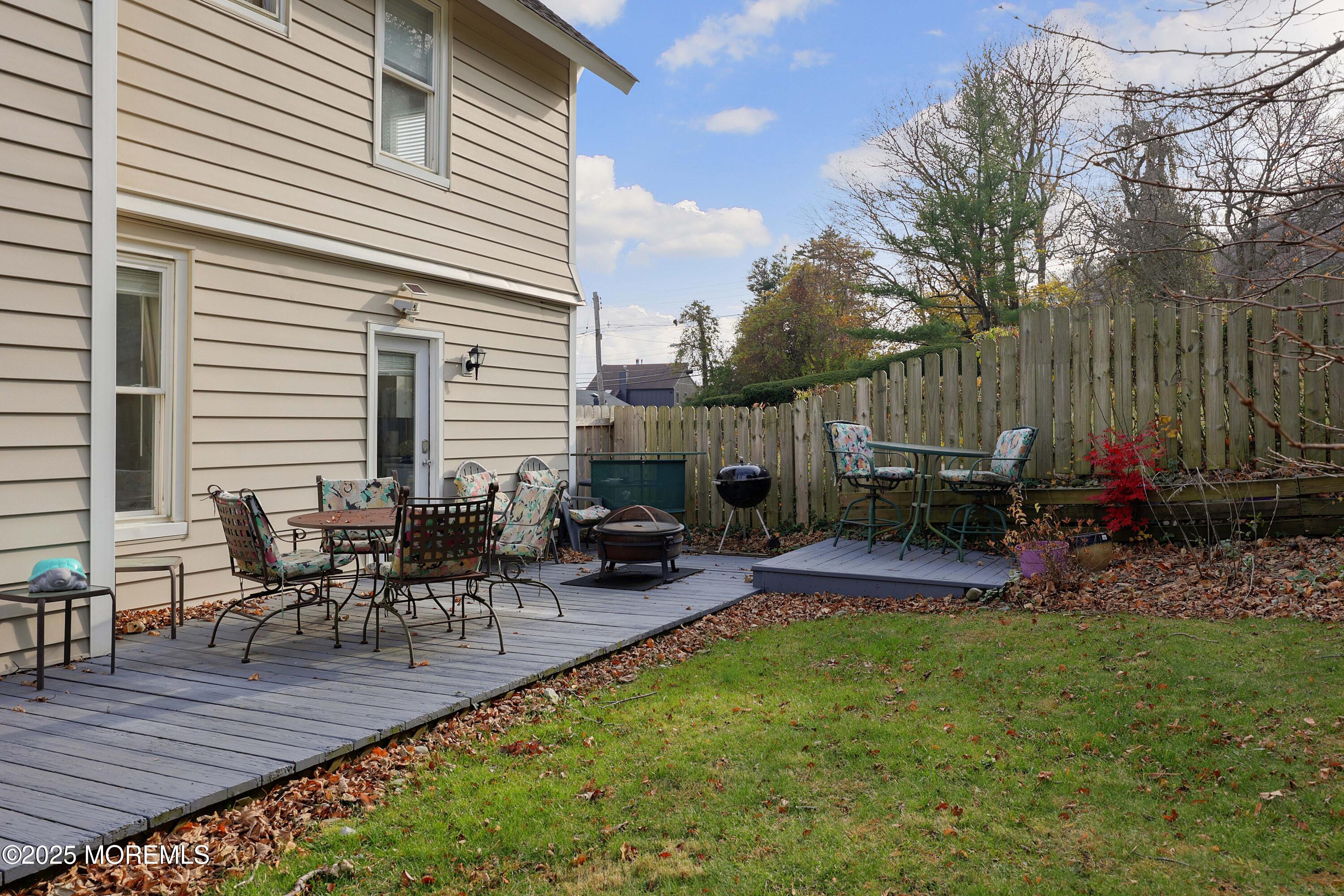 75 Portland Road Highlands, NJ 07732 - Photo 38 of 56 a view of a backyard with sitting area and furniture