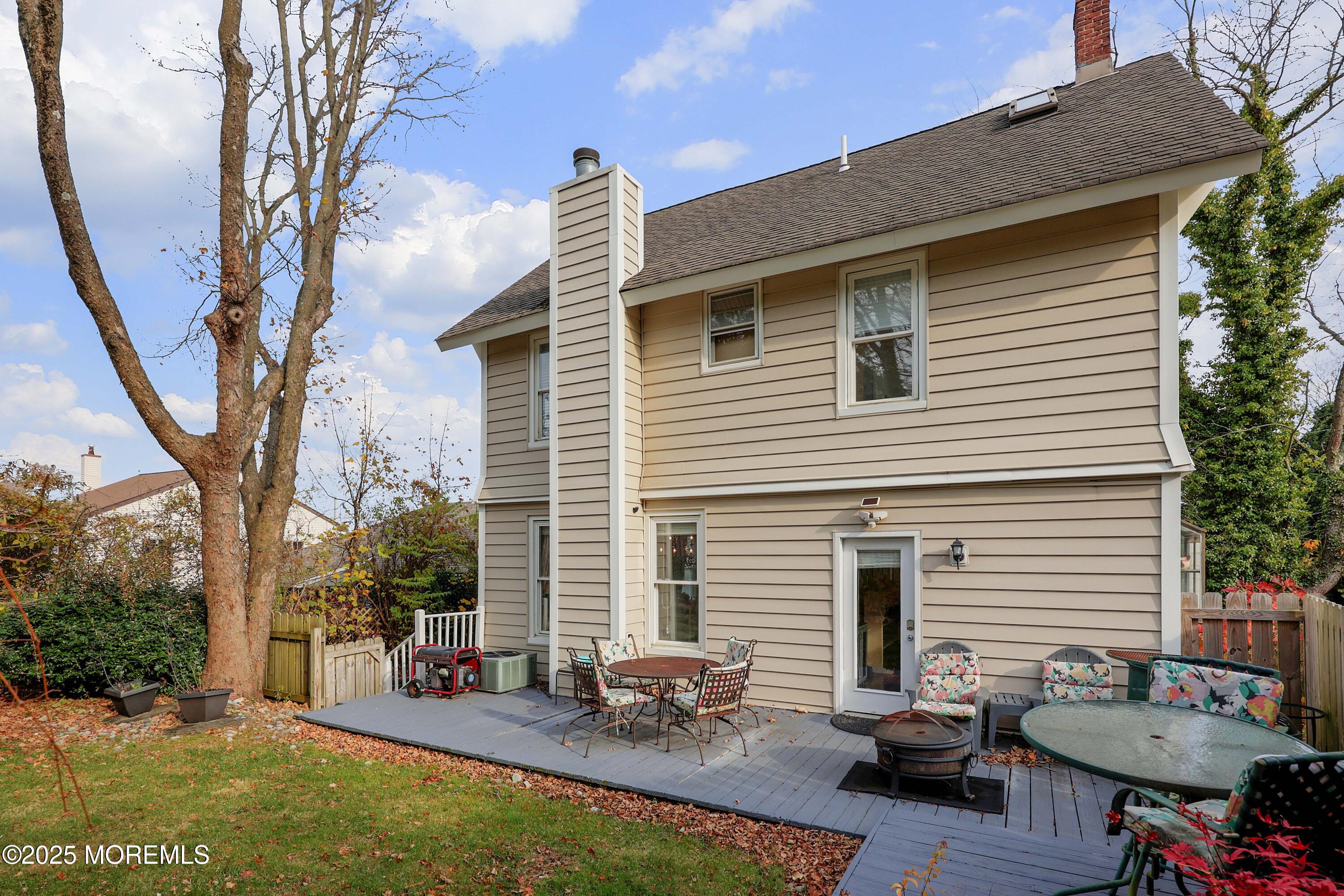 75 Portland Road Highlands, NJ 07732 - Photo 39 of 56 a backyard of a house with table and chairs