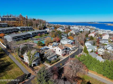 an aerial view of a residential building and lake view