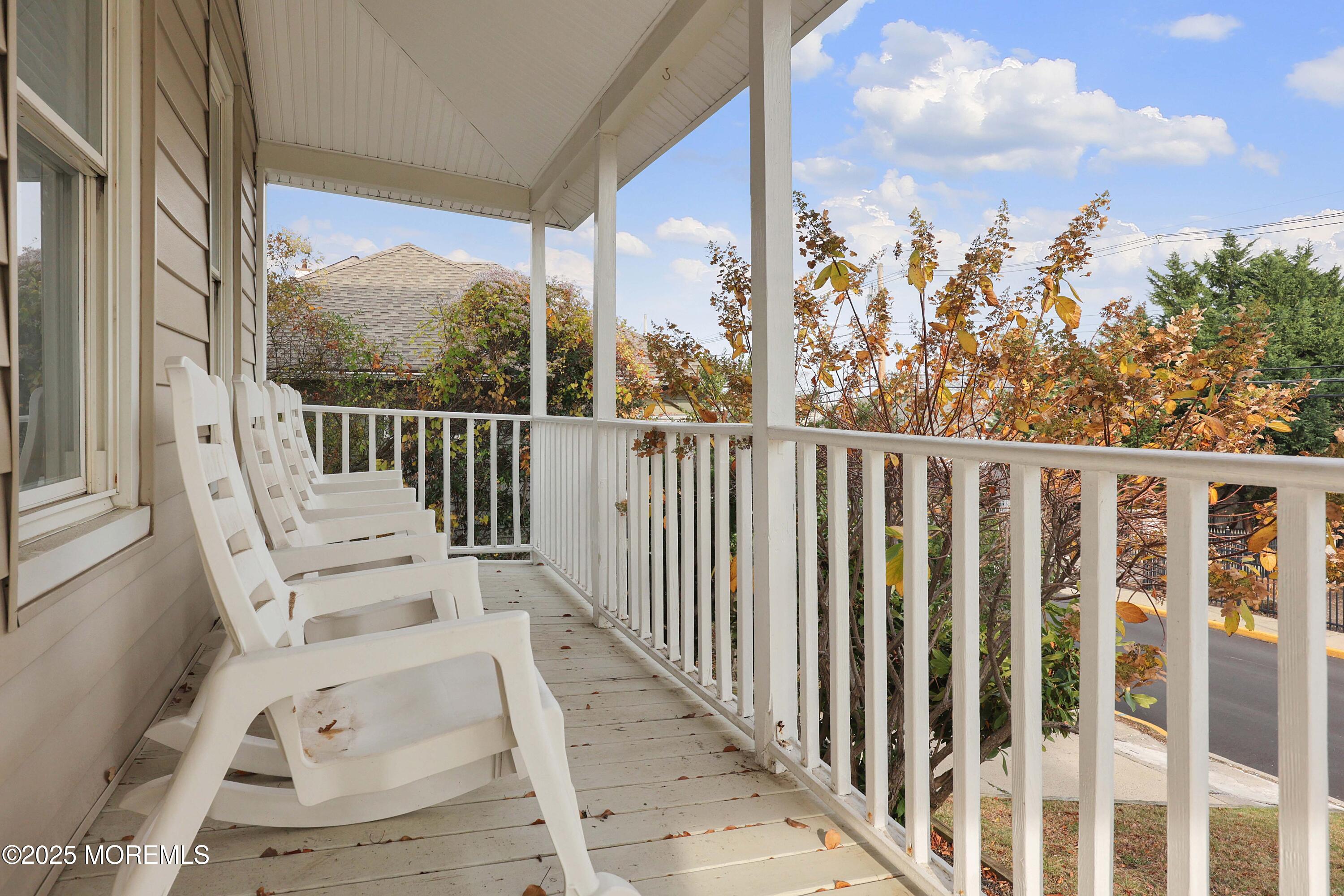 75 Portland Road Highlands, NJ 07732 - Photo 5 of 56 a view of a balcony with wooden floor and fence