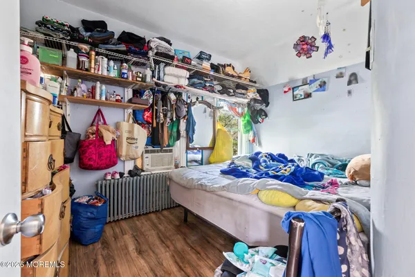 a bedroom with furniture and a bed