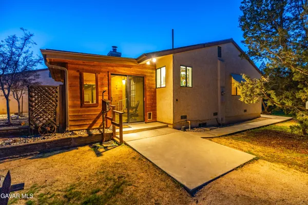 a kitchen with stainless steel appliances a refrigerator and a stove top oven