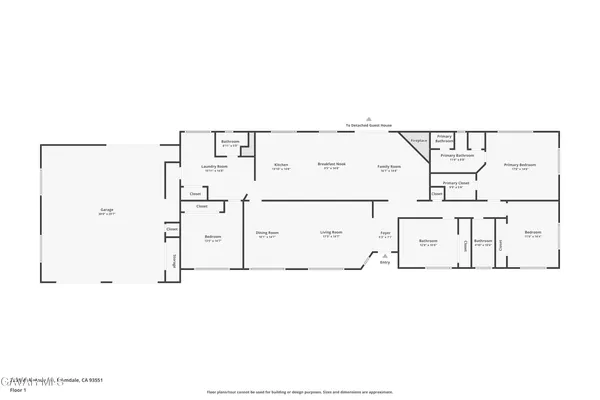 a living room with furniture a flat screen tv and a floor to ceiling window