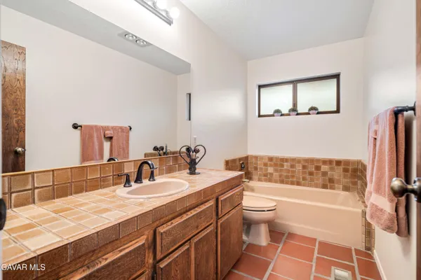 a kitchen with stainless steel appliances a refrigerator and a stove top oven