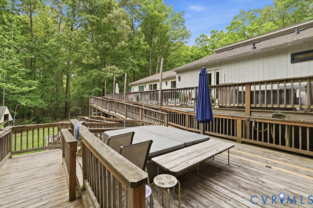 1061 Turkey Ridge Drive Moseley, VA 23120 - Photo 28 of 51 a view of balcony with wooden floor and outdoor seating