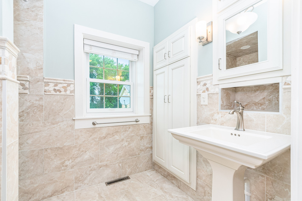 16071 Walker Road Newark, IL 60541 - Photo 16 of 41 a bathroom with a sink a mirror and a bathtub