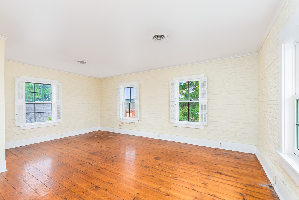 16071 Walker Road Newark, IL 60541 - Photo 19 of 41 a view of an empty room with wooden floor and a window