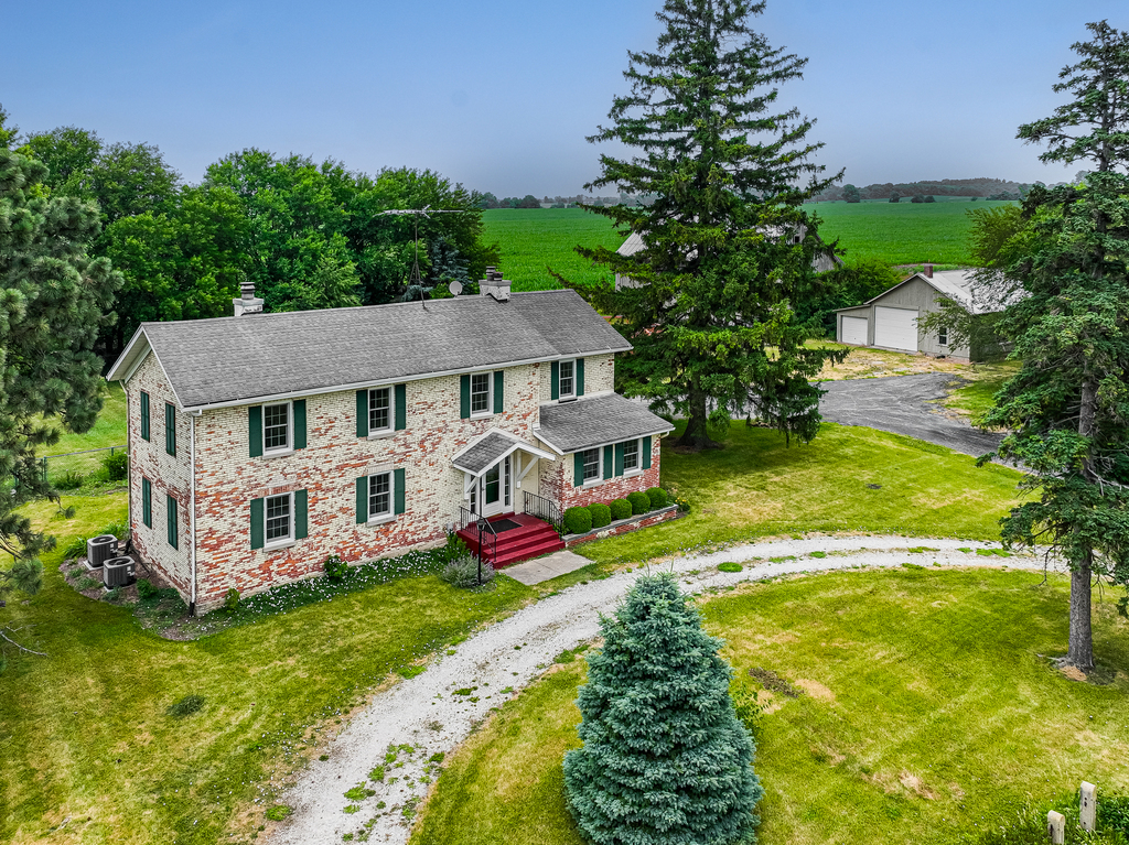 16071 Walker Road Newark, IL 60541 - Photo 2 of 41 a front view of a house with garden