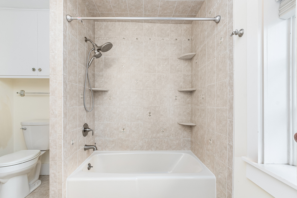 16071 Walker Road Newark, IL 60541 - Photo 23 of 41 a white bath tub sitting next to a white toilet and a shower