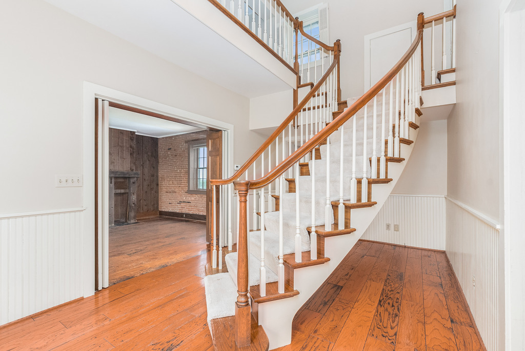 16071 Walker Road Newark, IL 60541 - Photo 7 of 41 a view of staircase with wooden floor and next to a window