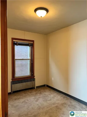 an empty room with mirror