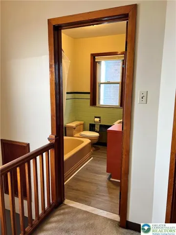 a spacious bathroom with a tub and shower
