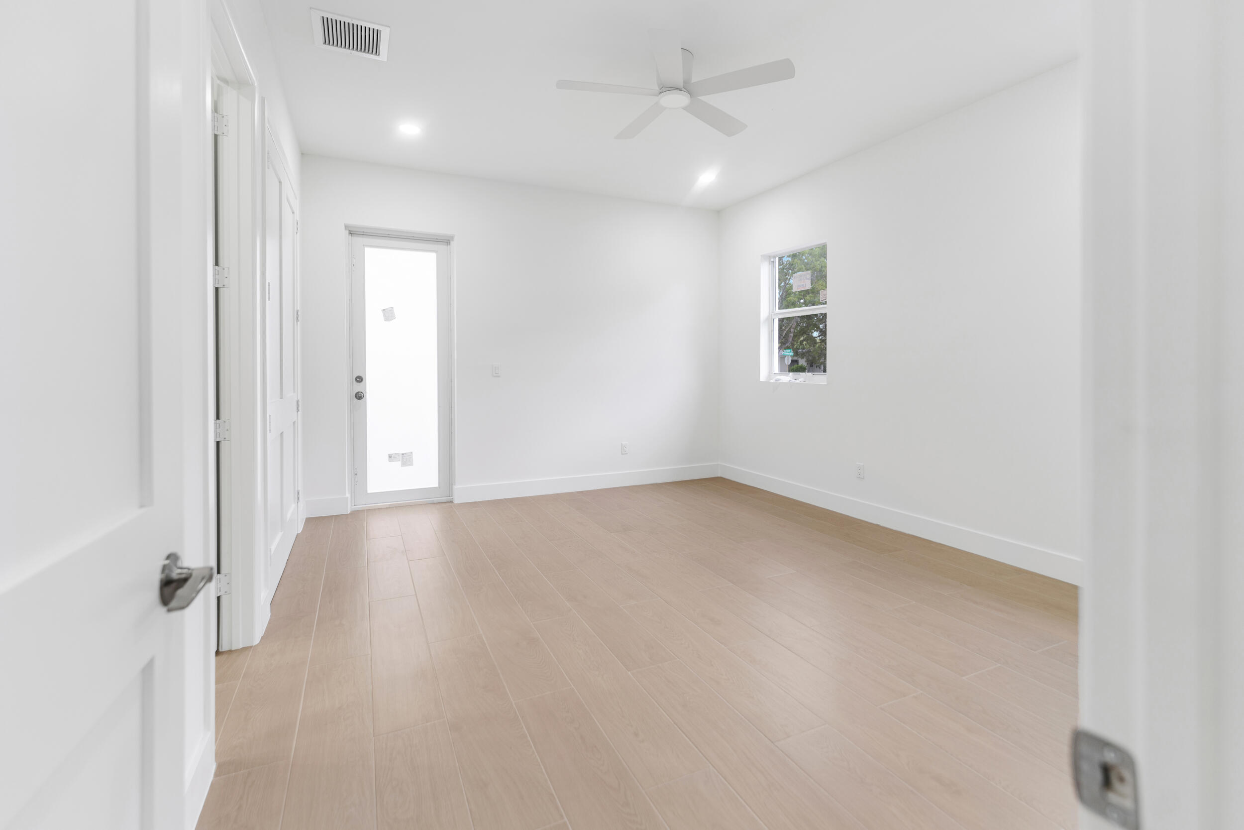 4641 Northview Drive Jupiter, FL 33458 - Photo 11 of 22 an empty room with a empty space and a ceiling fan