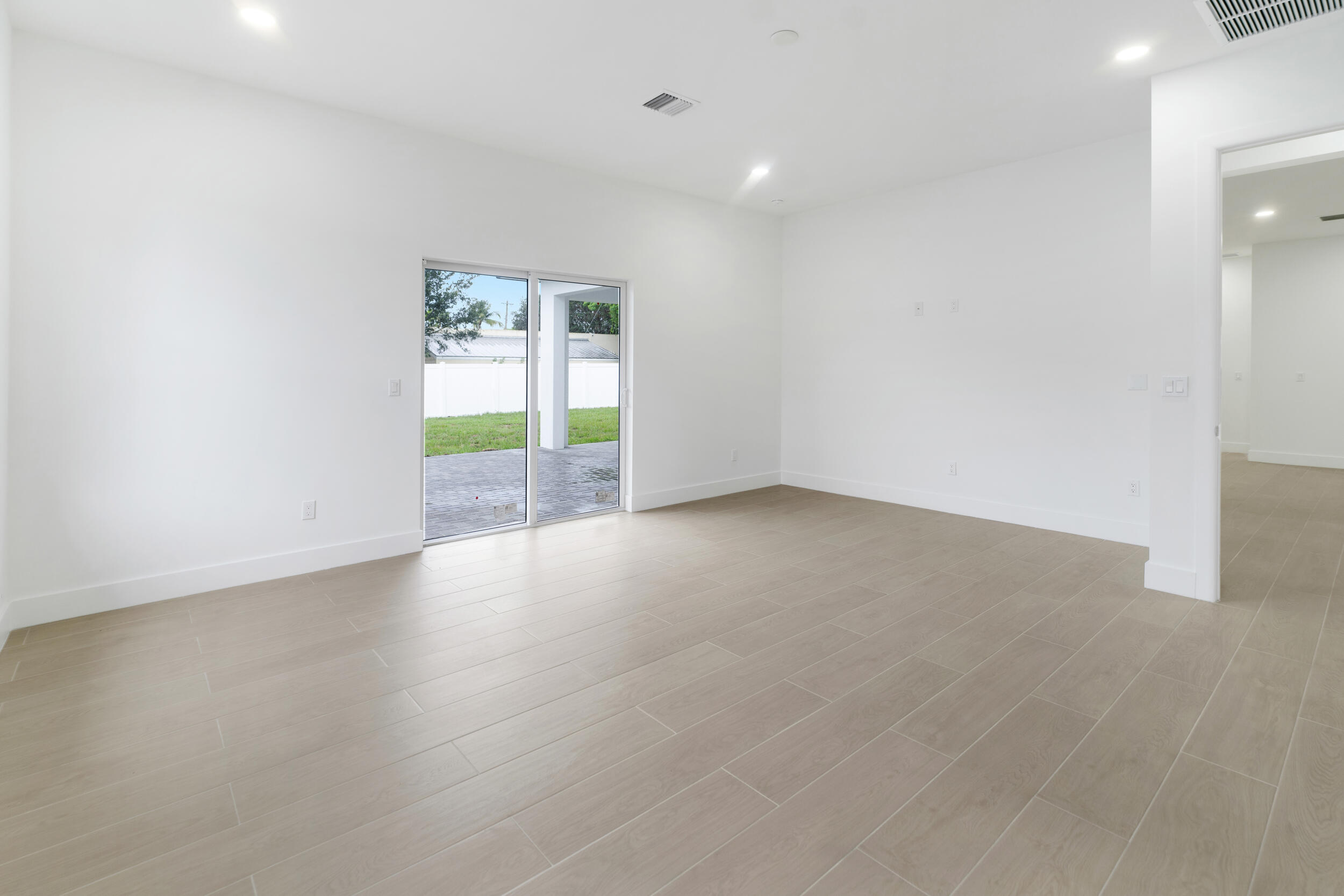 4641 Northview Drive Jupiter, FL 33458 - Photo 19 of 22 an empty room with windows
