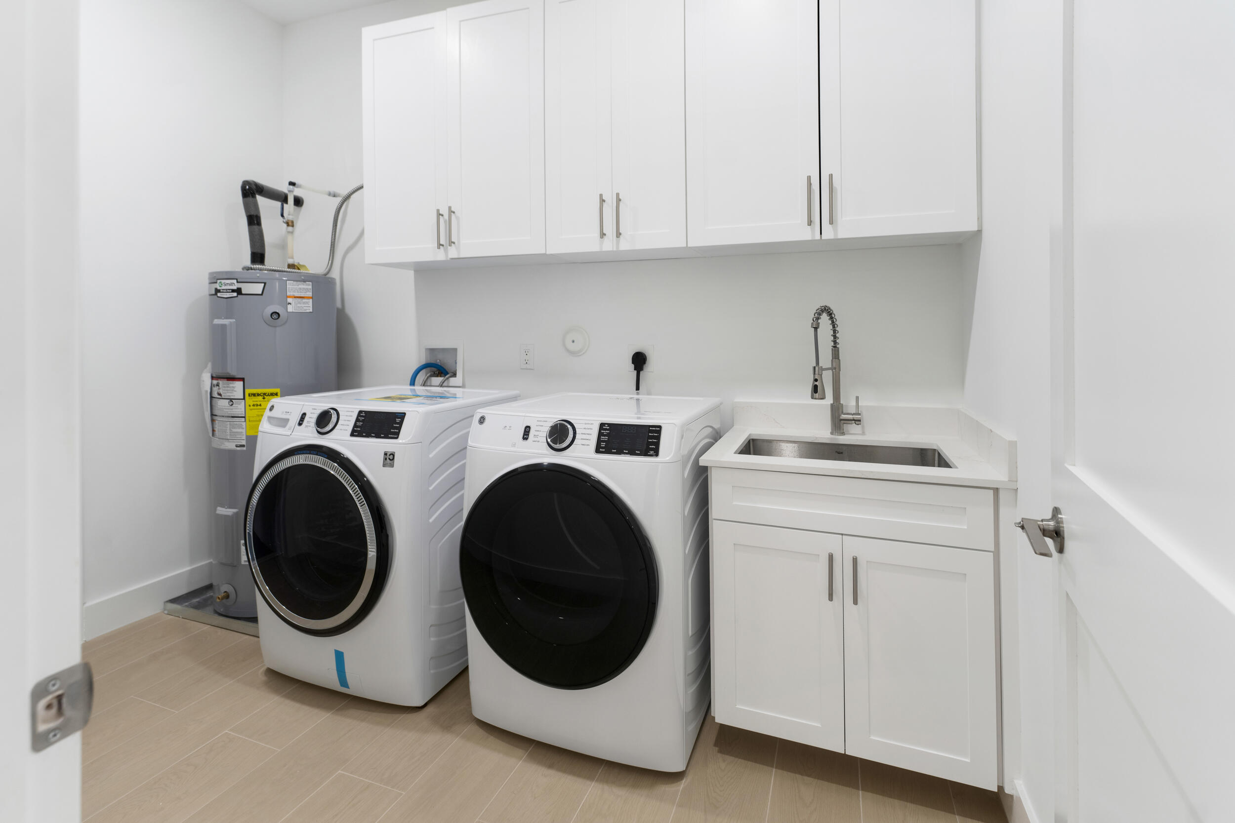 4641 Northview Drive Jupiter, FL 33458 - Photo 21 of 22 a utility room with dryer and washer