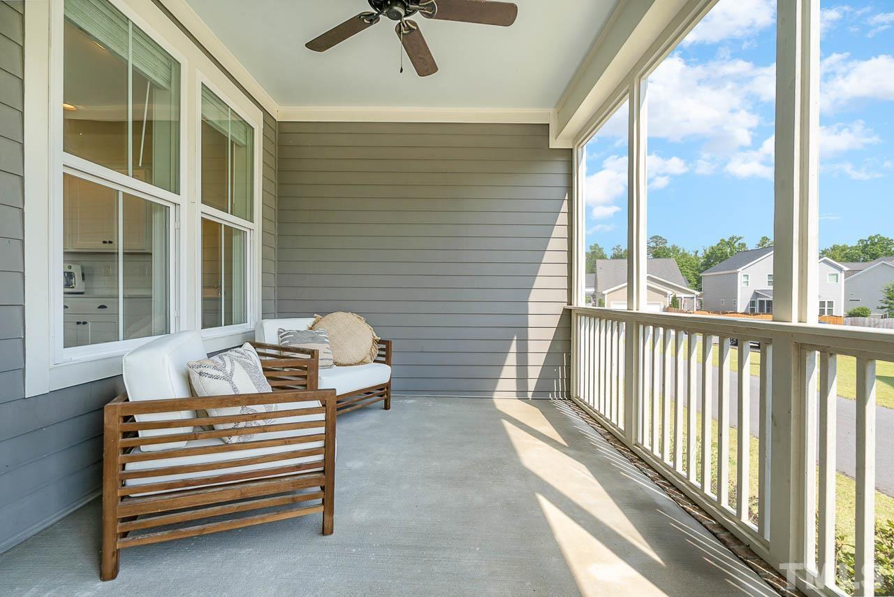 433 Daniel Ridge Rd. Wendell, NC 27591 - Photo 14 of 16 Screened porch leads directly off kitchen