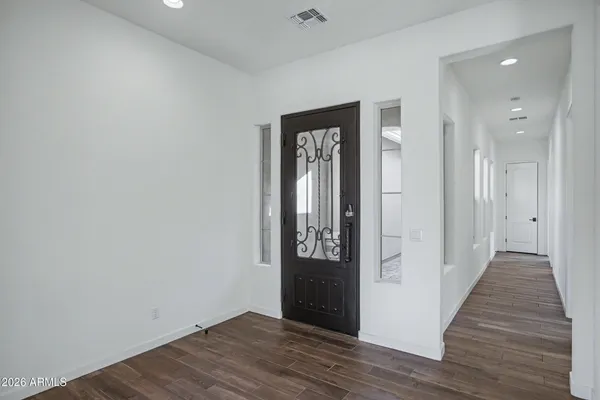 a view of entryway with wooden floor