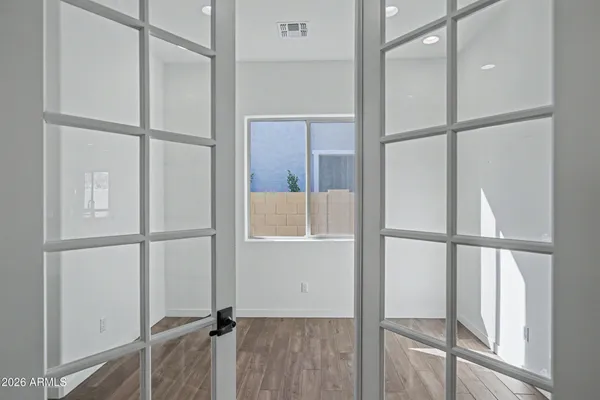 a bathroom with a sink a toilet a shower and a mirror