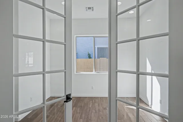 a bathroom with a sink a toilet a shower and a mirror